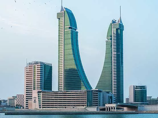  waterfront view of Bahrain Financial Harbour, with its distinctive twin towers rising gracefully against the skyline—home to Servcorp serviced offices