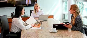 Servcorp clients connecting in a meeting room at 10 Avenue Kléber, supported by a premium business environment and services.